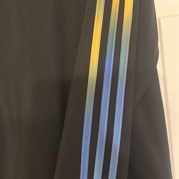 Black hoodie with gold,blue and green stripes on sleeve - Picture 3 of 7